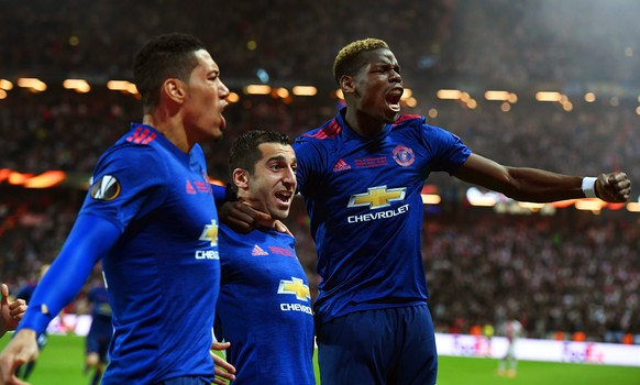 epa05987603 Manchester United&#039;s Henrikh Mkhitaryan (C) celebrates with his teammates Chris Smalling (L) and Paul Pogba (R) after scoring the 2-0 lead during the UEFA Europa League final between A ...