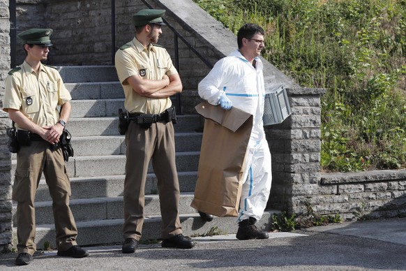 A police officer leaves a former hotel where a Syrian man lived before the explosion in Ansbach, Germany, Monday, July 25, 2016. Bavaria&#039;s top security official says a man who blew himself up aft ...