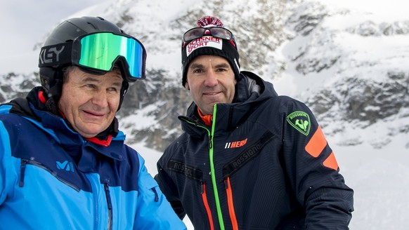 Didier Defago, right, former ski racer from Switzerland and designer of the slope, reacts with Franz Julen, left, President of the Organising Committee front of the new ski slope &quot;Gran Becca&quot ...