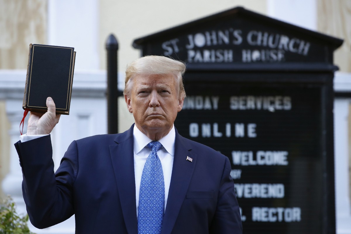 President Donald Trump holds a Bible as he visits outside St. John's Church across Lafayette Park from the White House Monday, June 1, 2020, in Washington. Part of the church was set on fire duri ...