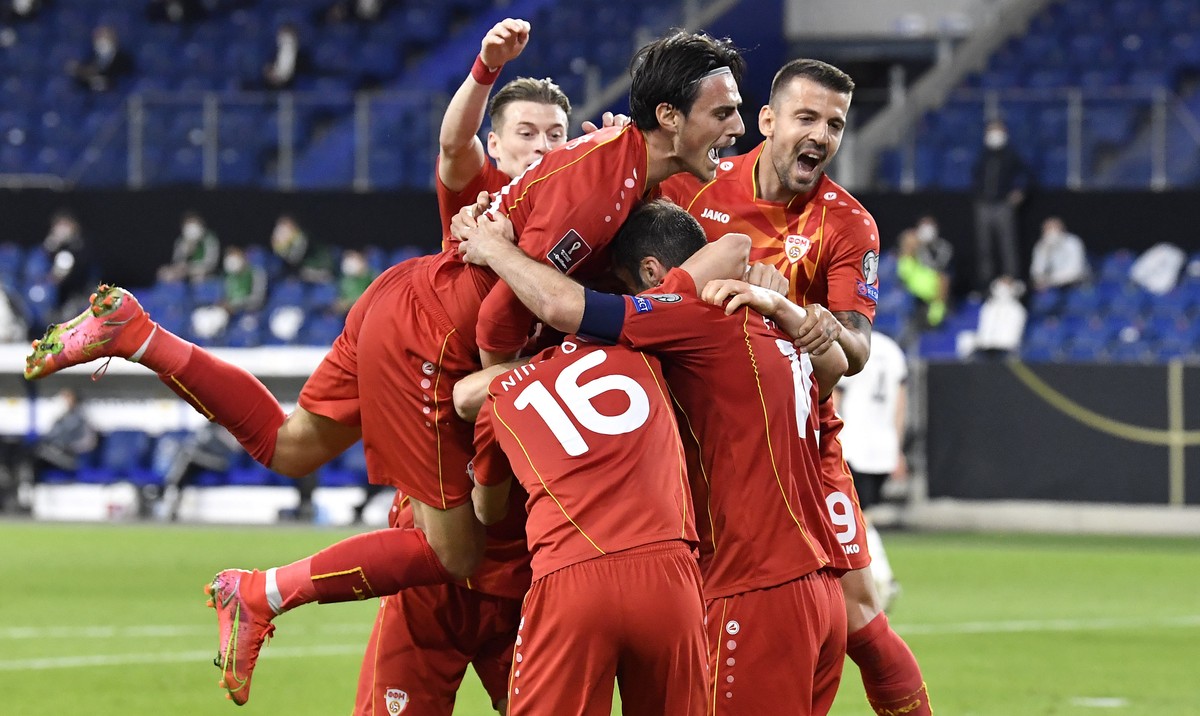 North Macedonia's Goran Pandev, right, is celebrated by his teammates after scoring his side's first goal during the World Cup 2022 group J qualifying soccer match between Germany and North  ...