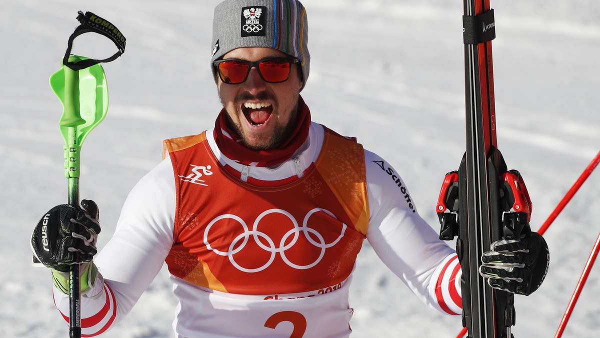 Austria's Marcel Hirscher celebrates after winning the gold medal in the men's combined at the 2018 Winter Olympics in Jeongseon, South Korea, Tuesday, Feb. 13, 2018. (AP Photo/Christophe En ...
