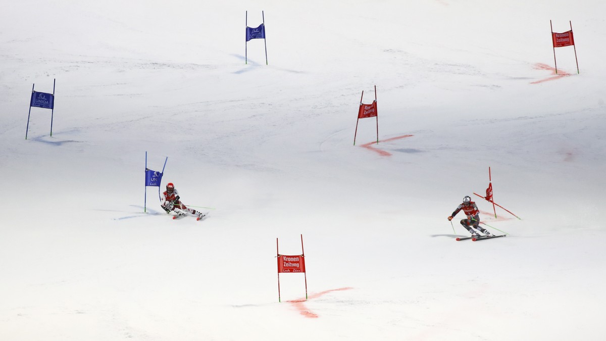 Austria's Christian Hirschbuehl, left, competes alongside Norway's Henrik Kristoffersen during an alpine ski, men's World Cup parallel event, in Lech/Zuers, Austria, Sunday, Nov. 14, 20 ...