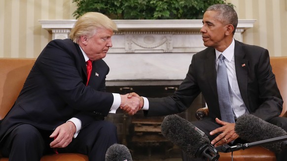 In this Nov. 10, 2016 photo, President Barack Obama and President-elect Donald Trump shake hands following their meeting in the Oval Office of the White House in Washington. (AP Photo/Pablo Martinez M ...