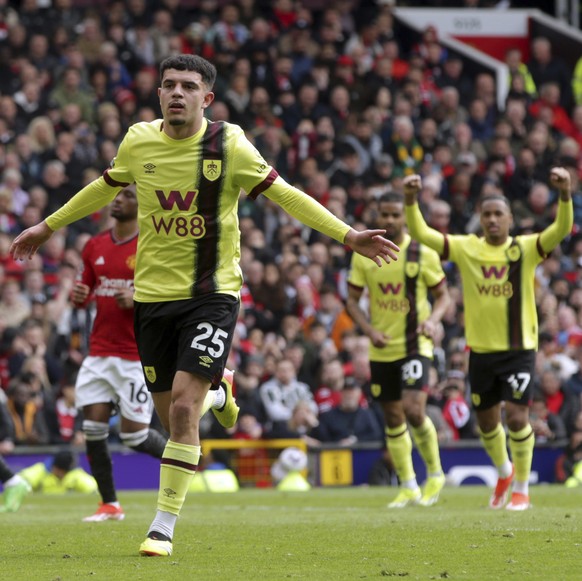 Burnley&#039;s Zeki Amdouni celebrates after scoring his side&#039;s first goal during the English Premier League soccer match between Manchester United and Burnley at Old Trafford, Manchester, Englan ...