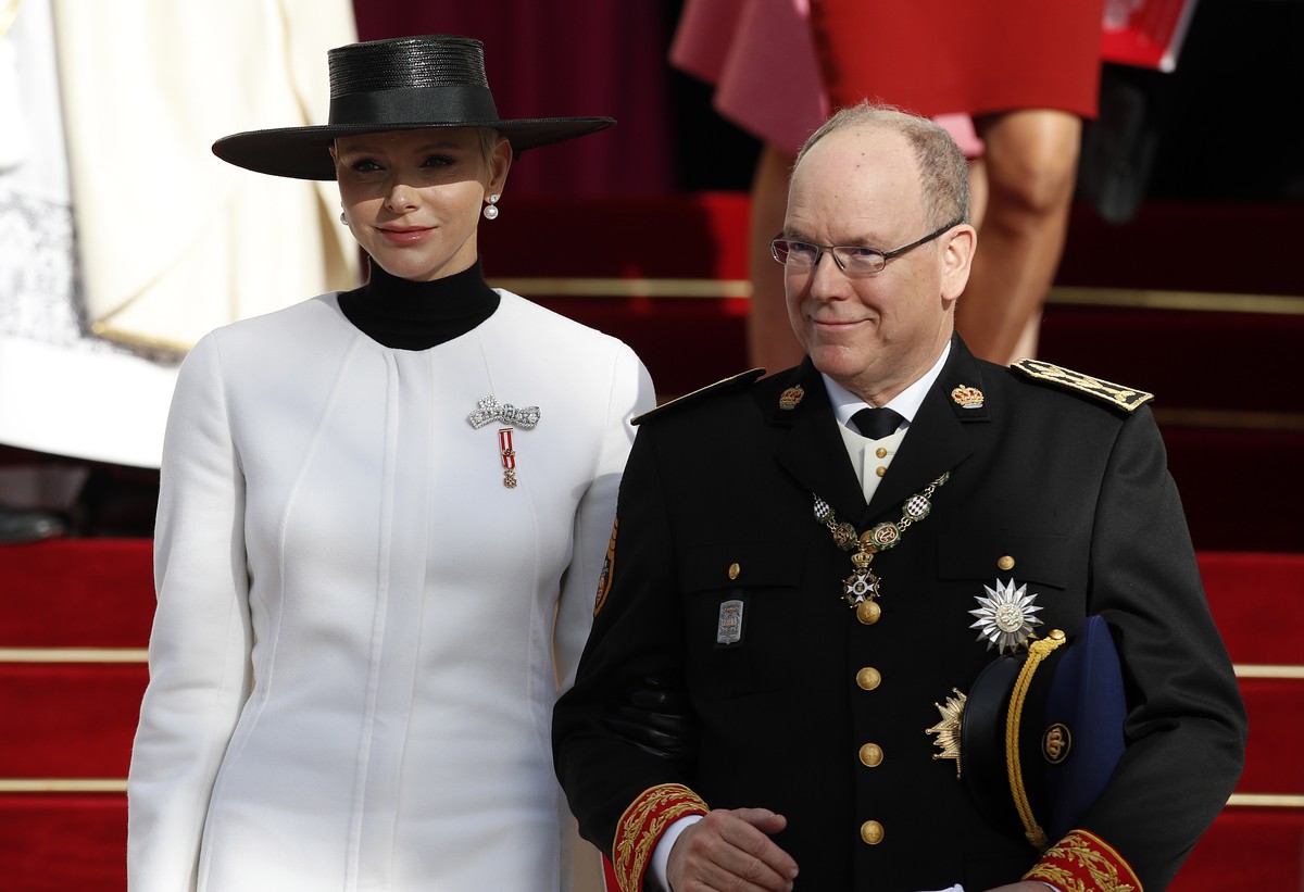 epa10314454 Prince Albert of Monaco (R) and his wife Princess Charlene of Monaco (L) leave the Cathedral of Monaco after attending the celebrations marking National Day at the Monaco Palace, in Monaco ...