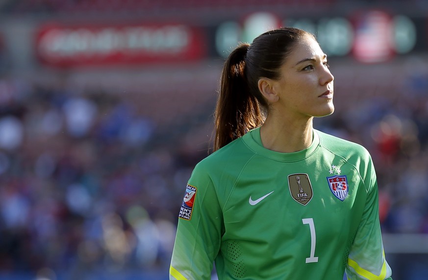 FILE - In this Feb. 13, 2016, file photo, United States goalie Hope Solo walks off the field at half time of a CONCACAF Olympic qualifying tournament soccer match against Mexico in Frisco, Texas. With ...
