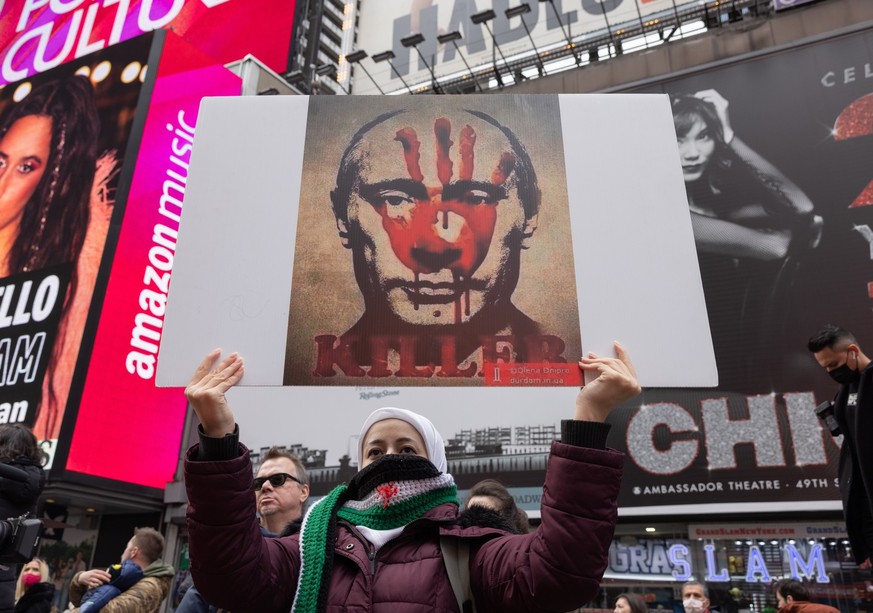 NEW YORK, N.Y. – March 5, 2022: A demonstrator is seen in Times Square during a protest against Russia’s invasion of Ukraine.