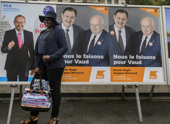 Auf dem CVP-Plakat posieren Claude Béglé und Jacques Neirynck einträchtig nebeneinander, in Wirklichkeit bekämpfen sie sich heftig.