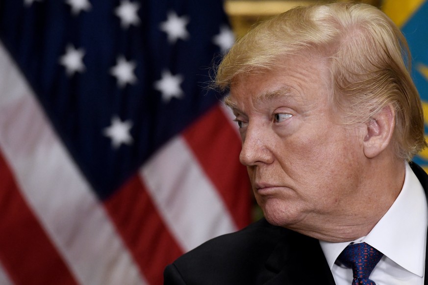 epa06444210 US President Donald J. Trump listens to President Nursultan Nazarbayev President Nursultan Nazarbayev of Kazakhstan during a joint press conference in the Roosevelt Room of the White House ...