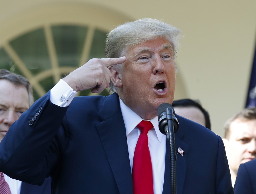 President Donald Trump gestures as he answers questions from members of the media about Supreme Court nominee Judge Brett Kavanaugh in the Rose Garden of the White House in Washington, Monday, Oct. 1, ...
