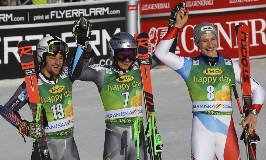 From left, second placed Norway&#039;s Rasmus Windingstad, the winner, Norway&#039;s Henrik Kristoffersen and third placed Switzerland&#039;s Marco Odermatt celebrate in the finish area after an Alpin ...