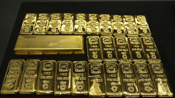 A 12.441 kg gold bar sits amongst one kilogram gold cast bars with 99.99% purity ready for sale at the ABC Refinery in Sydney, Australia, Wednesday, April 30, 2025. (AP Photo/Mark Baker)
Australia Gol ...