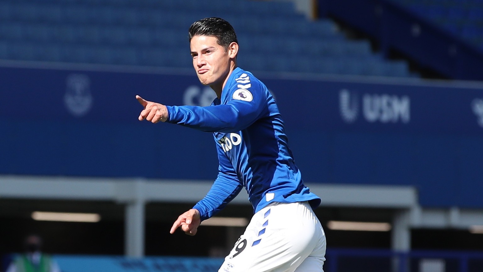 epa08680688 James Rodriguez of Everton (L) scores his team second goal during the English Premier League match between Everton and West Bromwich Albion in Liverpool, Britain, 19 September 2020. EPA/Ni ...