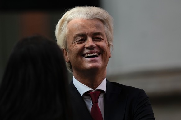 Populist Dutch anti-immigration lawmaker Geert Wilders talks to others prior to a ceremony where Dutch King Willem-Alexander marked the opening of the parliamentary year with a speech outlining the go ...