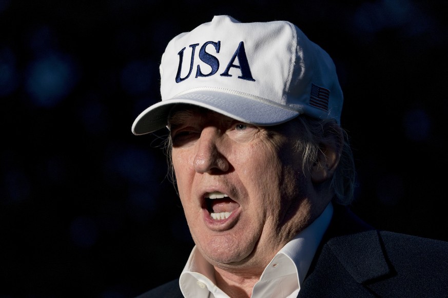 President Donald Trump speaks to members of the media on the South Lawn at the White House in Washington, Sunday, Dec. 17, 2017, after returning from Camp David in Maryland. Trump says he&#039;s not p ...