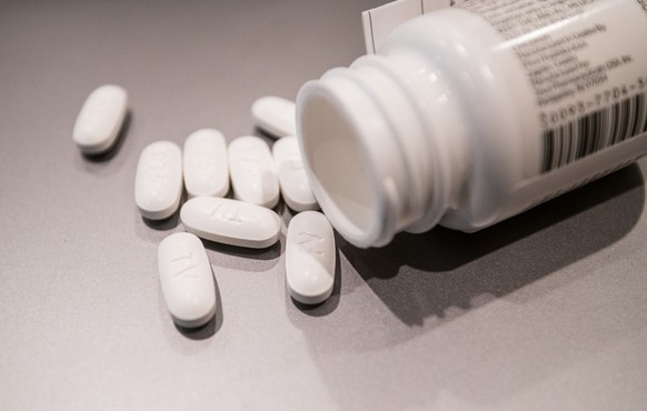Close up of generic PrEP medicine tablets, BOSTON, MASSACHUSETTS; APRIL 12, 2021 : Close-up view of a bottle of generic PrEP Pills for Pre-Exposure Prophylaxis to protect people from HIV. Generic Emtr ...