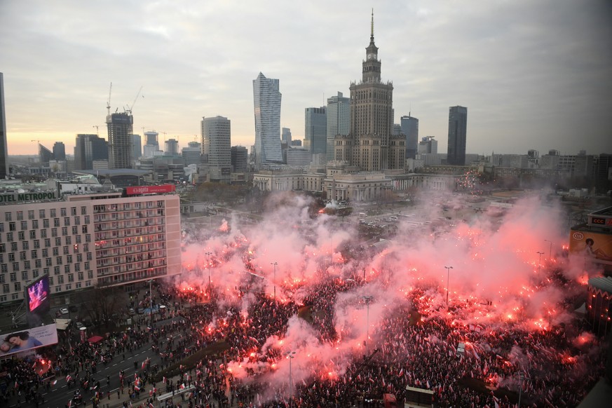 epa07988733 Participants of the March of Independence 2019 gathered in the centre Warsaw, Poland, 11 November 2019. The march will go through the streets of Warsaw towards the National Stadium for the ...