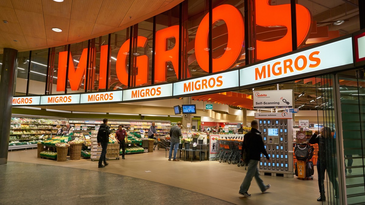 Migros Flughafen, ZURICH, SWITZERLAND - CIRCA OCTOBER, 2018: entrance to Migros supermarket in Zurich International Airport. Migros is Switzerlands largest retail company