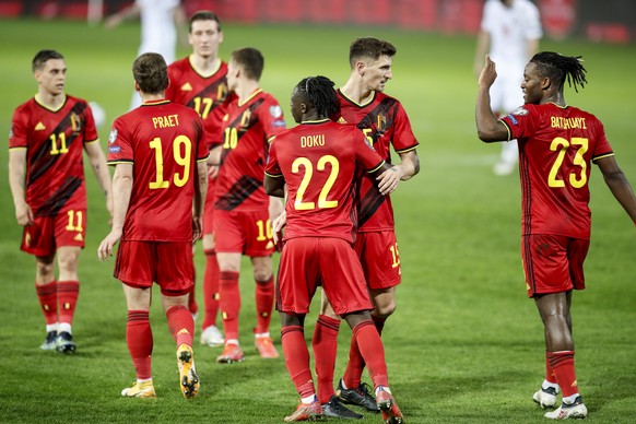 Belgium's Jeremy Doku, right, celebrates after scoring his side's fourth goal during a World Cup 2022 group E qualifying soccer match between Belgium and Belarus at the King Power stadium in ...