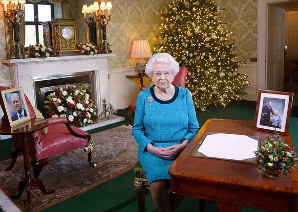 LONDON, ENGLAND - DECEMBER 24: Queen Elizabeth II sits at a desk in the Regency Room after recording her Christmas Day broadcast to the Commonwealth at Buckingham Palace on December 24, 2016 in London ...