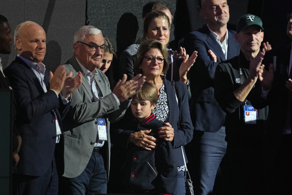 Robert Federer, Lynette and Mirka, the father, mother and wife of Team Europe's Roger Federer applaud after he played with Rafael Nadal in a Laver Cup doubles match against Team World's Jack ...