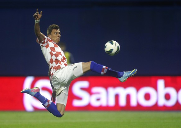 FILE - In this June 7, 2013, file photo, Croatia&#039;s Mario Mandzukic kicks the ball during the group A World Cup qualifying soccer match between Croatia and Scotland, in Zagreb, Croatia. Mandzukic, ...