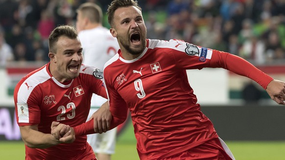 Switzerland&#039;s Xherdan Shaqiri, left, and Switzerland&#039;s Haris Seferovic, right, cheer after scoring during the 2018 Fifa World Cup Russia group B qualification soccer match between Hungary an ...