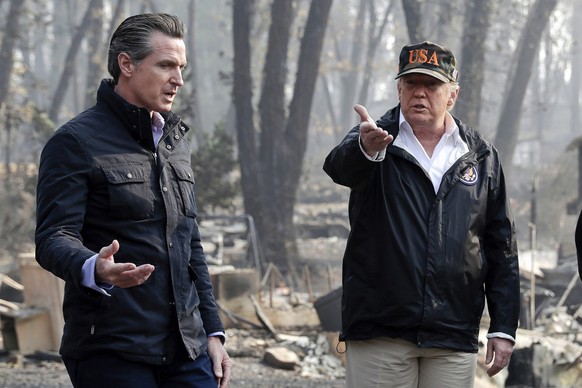 FILE - President Donald Trump talks with then California Gov.-elect Gavin Newsom, left, during a visit to a neighborhood impacted by the wildfires in Paradise, Calif., Nov. 17, 2018. (AP Photo/Evan Vu ...