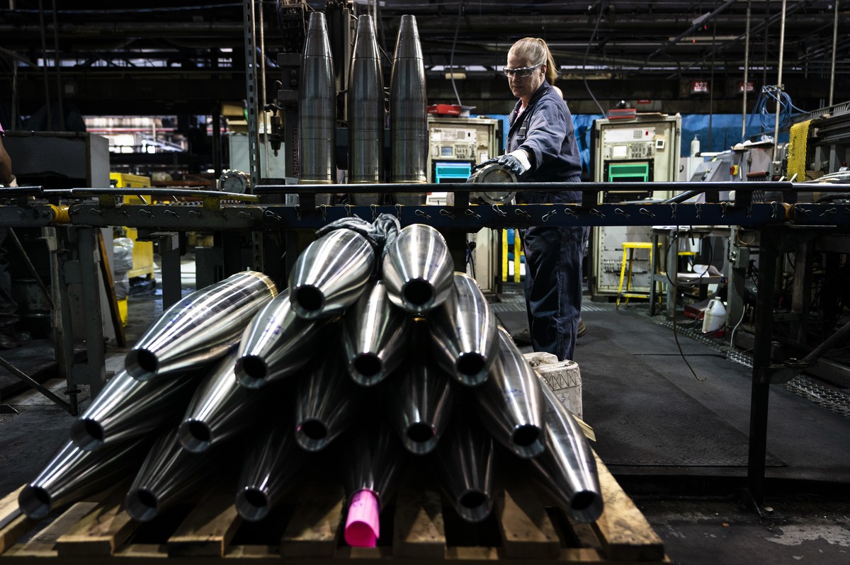 A steel worker moves a 155 mm M795 artillery projectile during the manufacturing process at the Scranton Army Ammunition Plant in Scranton, Pa., Thursday, April 13, 2023. One of the most important mun ...
