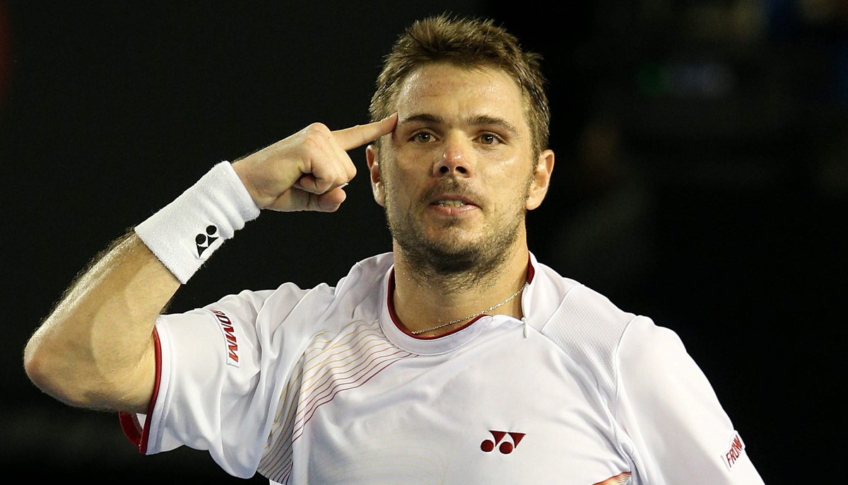 epa04038012 Stanislas Wawrinka of Switzerland celebrates after winning his match against Tomas Berdych of the Czech Republic during his match against in the semifinals of the Australian Open tennis to ...