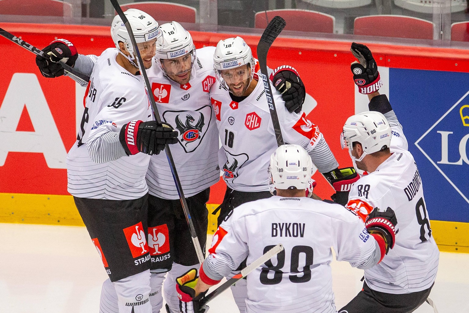 Players of Fribourg L-R Julien Sprunger, Raphael Diaz, Ryan Gunderson, Andrej Bykov and Christopher Didomenico celebrate victory in the hockey Champions League group F game HC Ocelari Trinec vs Fribou ...