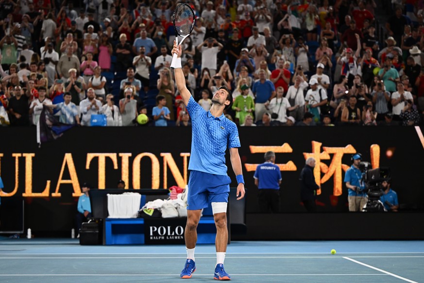 epa10411174 Novak Djokovic of Serbia celebrates winning against Roberto Carballes Baena of Spain during their first round match at the 2023 Australian Open tennis tournament at Melbourne Park in Melbo ...