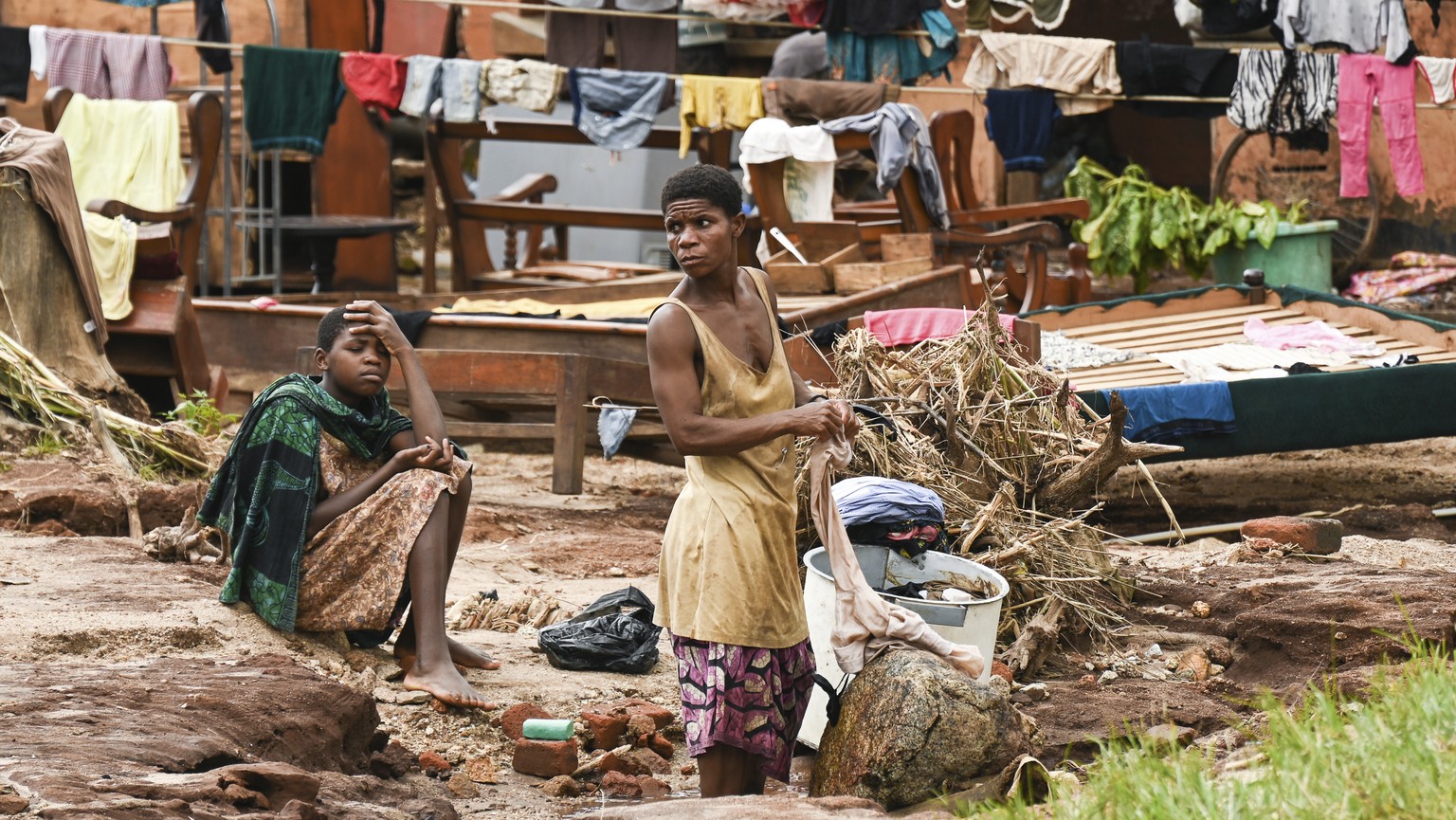 Clothes are hung to dry on power lines triggered by last week's heavy rains brought on by Tropical Cyclone Freddy in Phalombe, southern Malawi, Saturday, March 18, 2023. (AP Photo/T…