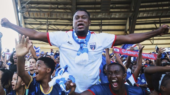KEYPIX - Fans celebrate in the stands after Cape Verde defeated Eswatini in a World Cup qualifying soccer match at Estádio Nacional in Praia, Cape Verde, Monday, Oct. 13, 2025, to clinch their qualifi ...