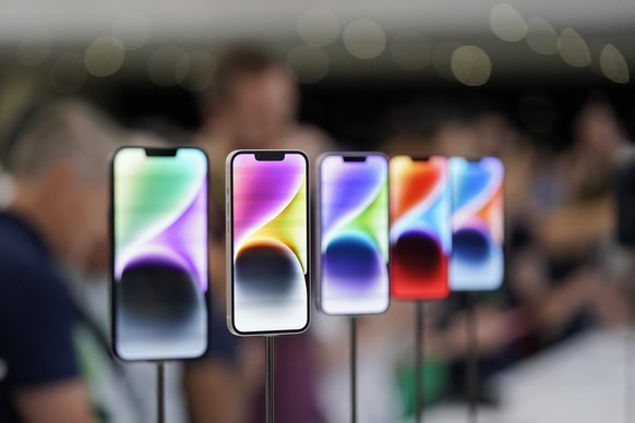 FILE- New iPhone 14 models on display at an Apple event on the campus of Apple&#039;s headquarters in Cupertino, Calif., Sept. 7, 2022. Apple Inc. will manufacture its latest iPhone 14 in India, the c ...