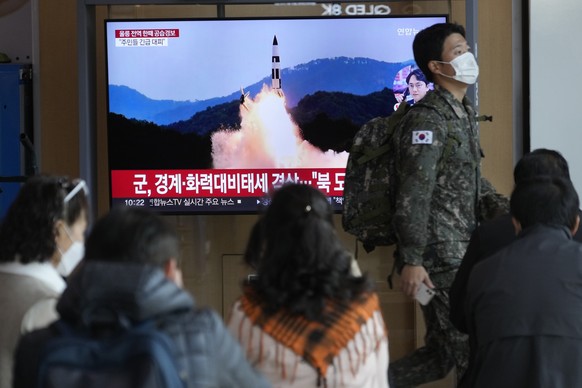 A South Korean army soldier passes by a TV screen showing a file image of North Korea&#039;s missile launch during a news program at the Seoul Railway Station in Seoul, South Korea, Wednesday, Nov. 2, ...