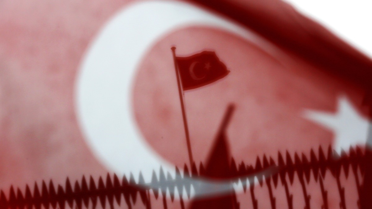 epa05843833 A Turkish flag flies on the roof of the Dutch Consulate during a protest in Istanbul, Turkey 12 March 2017. Turkish Family Minister Fatma Betul Sayan Kaya was barred by police from enterin ...