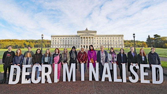 Pro-choice activists take part in a photo call in the grounds of Stormont Parliament, Belfast, Monday Oct. 21, 2019. Abortion is set to be decriminalized and same-sex marriage legalized in Northern Ir ...