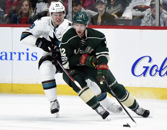 Minnesota Wild center Eric Staal (12) controls the puck against San Jose Sharks center Tomas Hertl (48), of the Czech Republic, during the second period of an NHL hockey game, Sunday, March 5, 2017, i ...