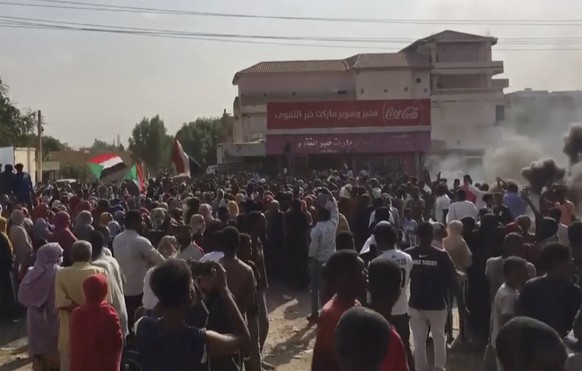 In this frame taken from video people burn tires and block a street during a protest in Khartoum, Sudan, Monday, Oct. 25, 2021. Sudan���s leading general Abdel-Fattah Burhan declared a state of emerge ...