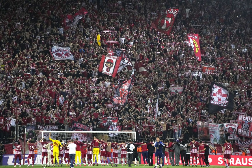 Olympiacos players celebrate their victory at the Europa Conference League semifinal, second leg, soccer match between Olympiacos and Aston Villa at the Georgios Karaiskakis stadium at Athens&#039; po ...