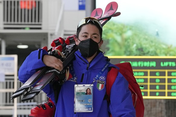 Italian skier Sofia Goggia walks toward the gondola to take her up the mountain at the alpine skiing venue at the 2022 Winter Olympics, Wednesday, Feb. 9, 2022, in the Yanqing district of Beijing. Gog ...