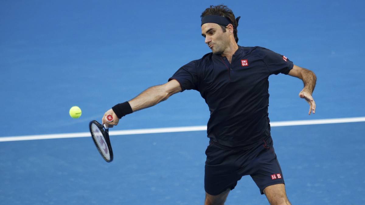 Switzerland's Roger Federer plays a return during his match against Britain's Cameron Norrie at the Hopman Cup in Perth, Australia, Sunday Dec. 30, 2018. (AP Photo/Trevor Collens)