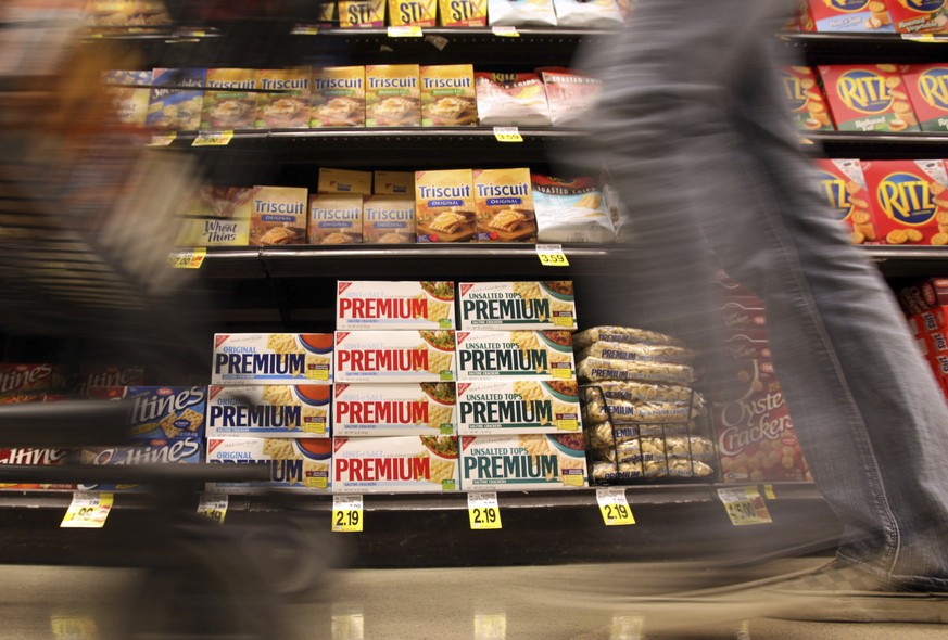 FILE - In this Feb. 9, 2011, photo, a shopper passes Nabisco products, a Mondelez International brand: Premium saltines, Triscuits, Ritz crackers and Wheat Thins, at a supermarket in Los Angeles. Ukra ...