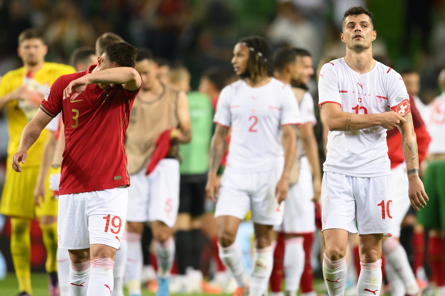 Switzerland&#039;s Granit Xhaka, right, and Mario Gavranovic, left, look disappointed after losing the UEFA Nations League group A2 soccer match between Portugal and Switzerland at the Estadio Jose Al ...