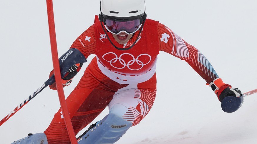 Michelle Gisin of Switzerland passes a gate during the women&#039;s combined slalom at the 2022 Winter Olympics, Thursday, Feb. 17, 2022, in the Yanqing district of Beijing. (AP Photo/Alessandro Trova ...
