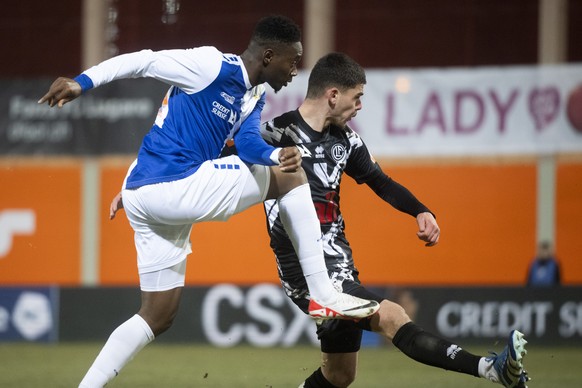 From left Grasshopper&#039;player Club Zurich Francis Momoh and Lugano?s player Albian Hajdari, during the Super League soccer match FC Lugano against Grasshoppers Club Zurich, at the Cornaredo Stadiu ...