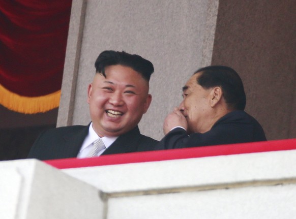 epa05908581 North Korean leader Kim Jong-un (L) speaks with North Korean Premier Park Pong-ju (R) during a parade for the &#039;Day of the Sun&#039; festival on Kim Il-sung Square in Pyongyang, North  ...