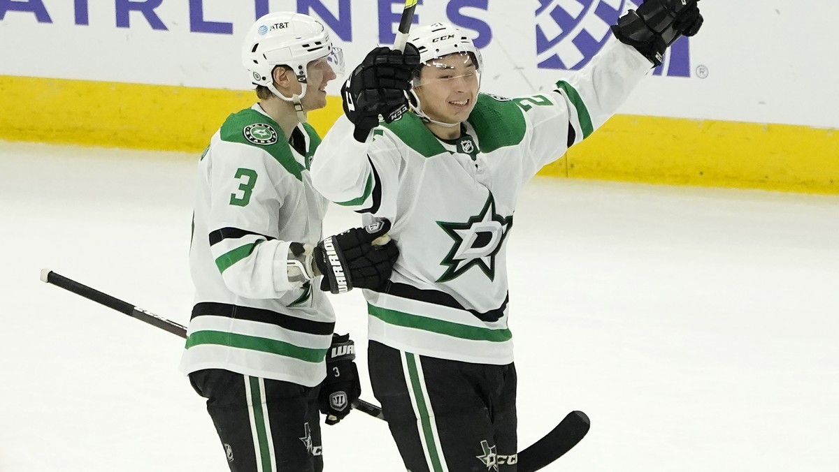 Dallas Stars' Jason Robertson, right, celebrates his game winning goal with John Klingberg during the overtime period of an NHL hockey game against the Chicago Blackhawks Monday, May 10, 2021, in ...